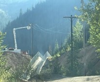 Wilson Construction Co. installing overhead powerlines on Bunker Hill property.